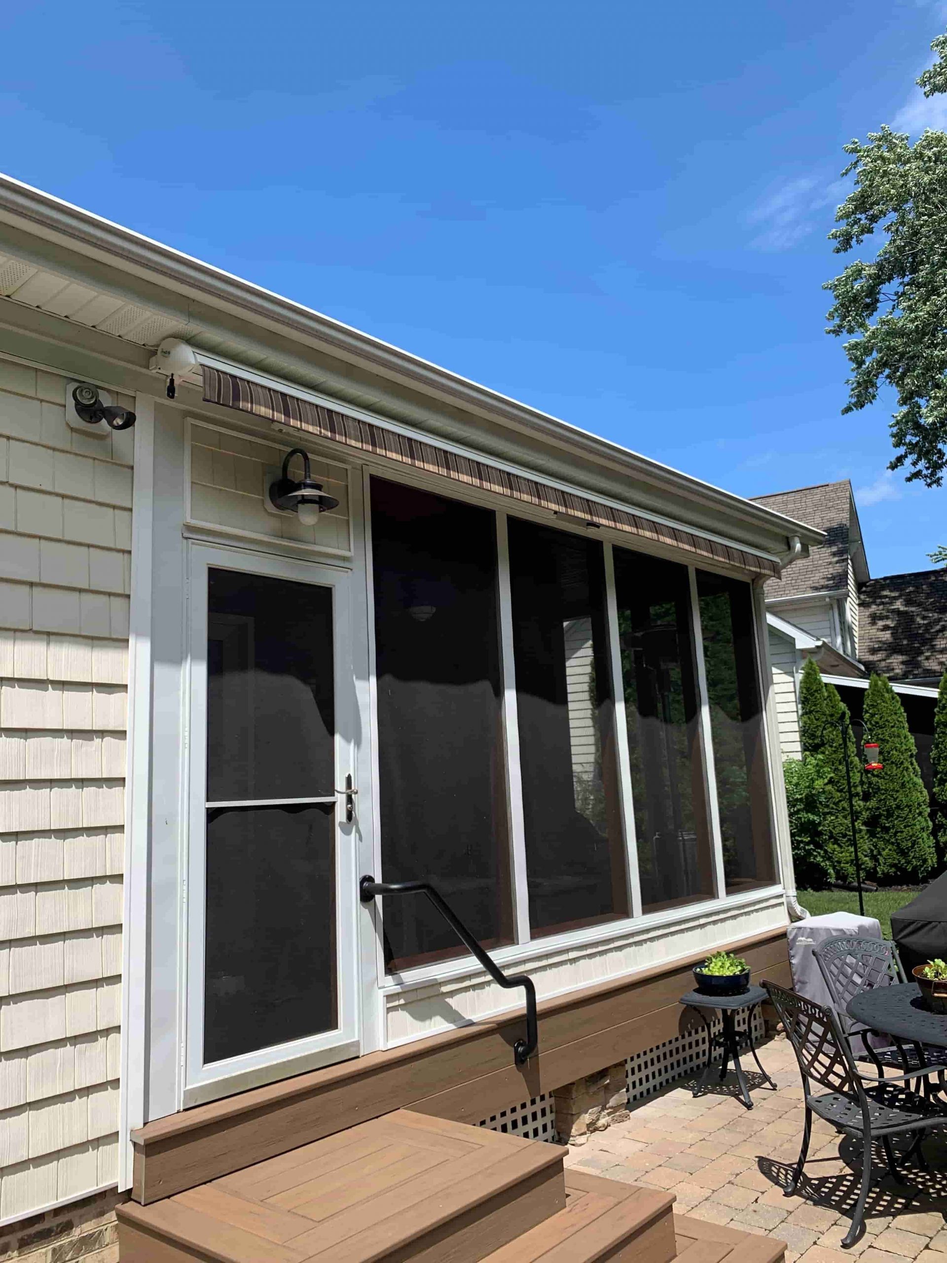 Awning installed on residential home in its fully retracted position